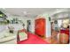 Bright living room with open shelves and a statement red cabinet at 531 Hunter St, Lakeland, FL 33803