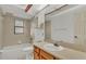 Bathroom featuring a tub and shower combination, single sink vanity, and tiled floors at 6228 Crane Dr, Lakeland, FL 33809