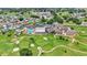 Bird's-eye view of community with golf course, pool, and tennis courts at 6235 Egret Dr, Lakeland, FL 33809