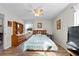 Cozy bedroom with wood flooring, ceiling fan, and plenty of natural light at 6235 Egret Dr, Lakeland, FL 33809