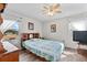 Cozy bedroom with wood flooring, ceiling fan, and plenty of natural light at 6235 Egret Dr, Lakeland, FL 33809