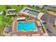 Aerial view of community pool with lounge chairs and surrounding amenities at 6235 Egret Dr, Lakeland, FL 33809