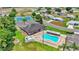 Aerial view of community pool, clubhouse, and tennis courts at 6235 Egret Dr, Lakeland, FL 33809