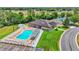 Community pool and clubhouse with tennis courts in the background at 6235 Egret Dr, Lakeland, FL 33809
