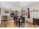 Bright dining area adjacent to living room with hardwood floors at 6235 Egret Dr, Lakeland, FL 33809