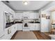 Well-equipped kitchen featuring white cabinets and granite countertops at 6235 Egret Dr, Lakeland, FL 33809
