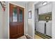 Bright laundry room with washer, dryer, and built-in storage at 6235 Egret Dr, Lakeland, FL 33809