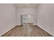 Spacious bedroom with hard wood flooring and sliding glass door leading to a screened porch at 6244 Napa Dr, Lakeland, FL 33813