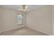 Neutral bedroom with carpet flooring and a ceiling fan, offering a calming space at 6244 Napa Dr, Lakeland, FL 33813