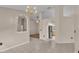 Open-concept dining area features tiled floors, chandelier lighting and connections to other living areas at 6244 Napa Dr, Lakeland, FL 33813