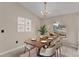 Bright dining room features a wooden table, seating for six, and a decorative chandelier at 6244 Napa Dr, Lakeland, FL 33813