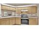 Cozy kitchen with light countertops and wood cabinets at 6244 Napa Dr, Lakeland, FL 33813