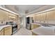 Bright kitchen showcasing stainless steel appliances, light wood cabinets, and ample counter space at 6244 Napa Dr, Lakeland, FL 33813