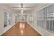 Spacious sunroom featuring hardwood floors, windows and sliding glass doors for natural lighting at 6244 Napa Dr, Lakeland, FL 33813
