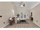Modern living room featuring sleek furniture, a ceiling fan, and bright french doors at 6244 Napa Dr, Lakeland, FL 33813
