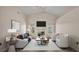 Well-lit living room featuring a fireplace, comfortable seating, and a vaulted ceiling at 6244 Napa Dr, Lakeland, FL 33813
