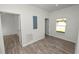 Bright hallway with doors to other rooms and wood-look floors at 631 S Westgate Ave, Lakeland, FL 33815