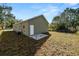 Newly built home with a side yard and small patio at 631 S Westgate Ave, Lakeland, FL 33815