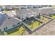 Aerial view of home with fenced backyard and solar panels at 637 Griffon Ave, Lake Alfred, FL 33850