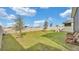 Fenced backyard with grassy lawn and a playground at 637 Griffon Ave, Lake Alfred, FL 33850