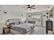Spacious bedroom with king-size bed and window seat at 637 Griffon Ave, Lake Alfred, FL 33850