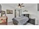 Comfortable bedroom with a queen-size bed and plenty of light at 637 Griffon Ave, Lake Alfred, FL 33850
