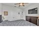 Spacious bedroom with a large bed and double door closet at 637 Griffon Ave, Lake Alfred, FL 33850