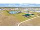 Community overview featuring pool, playground and homes at 637 Griffon Ave, Lake Alfred, FL 33850