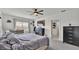 Relaxing main bedroom with a large window and dresser at 637 Griffon Ave, Lake Alfred, FL 33850