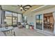 Relaxing screened porch with outdoor seating and view of backyard at 637 Griffon Ave, Lake Alfred, FL 33850