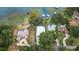 Aerial shot showcases luxury homes, pools, and waterfront access on a serene lake, surrounded by lush greenery at 739 Swann Dr, Lakeland, FL 33809