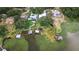 Stunning aerial shot of waterfront properties with private docks on a serene lake with lush greenery at 739 Swann Dr, Lakeland, FL 33809