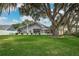 Beautiful backyard featuring a meticulously maintained lawn and a screened-in enclosure, perfect for relaxing at 739 Swann Dr, Lakeland, FL 33809