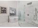 This primary bathroom features a soaking tub and glass enclosed shower with bench seating at 739 Swann Dr, Lakeland, FL 33809