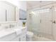 Bathroom featuring a glass shower, white vanity, and modern fixtures at 739 Swann Dr, Lakeland, FL 33809