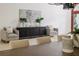 Dining room featuring modern lighting, elegant decor, stylish furniture, and decorative plants at 739 Swann Dr, Lakeland, FL 33809