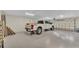 Spacious three car garage features epoxy flooring and ample storage at 739 Swann Dr, Lakeland, FL 33809