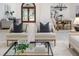 Inviting living room featuring modern furnishings, a decorative glass coffee table, and elegant decor at 739 Swann Dr, Lakeland, FL 33809