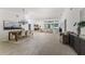 Spacious living area with modern furnishings, dining set, and view to an outdoor pool at 739 Swann Dr, Lakeland, FL 33809