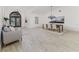 Open living space features tile floors, an arched entry, modern furnishings, and a dining area at 739 Swann Dr, Lakeland, FL 33809