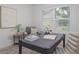 Bright office featuring a gray desk and chair, accented by artwork and natural light at 739 Swann Dr, Lakeland, FL 33809