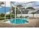 Screened in pool area, with lush landscaping at 739 Swann Dr, Lakeland, FL 33809