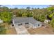 Single story home with gray roof and screened porch at 815 N Hendry Ave, Fort Meade, FL 33841