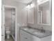 Updated bathroom with double vanity, granite countertop, and modern fixtures at 815 N Hendry Ave, Fort Meade, FL 33841
