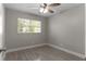 Well-lit bedroom with ceiling fan and neutral wall tones at 815 N Hendry Ave, Fort Meade, FL 33841