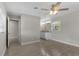 Spacious bedroom with ceiling fan and ensuite bathroom access at 815 N Hendry Ave, Fort Meade, FL 33841