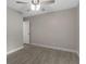 Spacious bedroom with tile floors and ceiling fan at 815 N Hendry Ave, Fort Meade, FL 33841