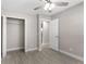 Bright bedroom with tile floors and a spacious closet at 815 N Hendry Ave, Fort Meade, FL 33841