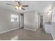 Bright bedroom with ceiling fan, ensuite bathroom, and ample space at 815 N Hendry Ave, Fort Meade, FL 33841