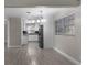 Bright dining area with kitchen view, modern flooring, and light fixtures at 815 N Hendry Ave, Fort Meade, FL 33841